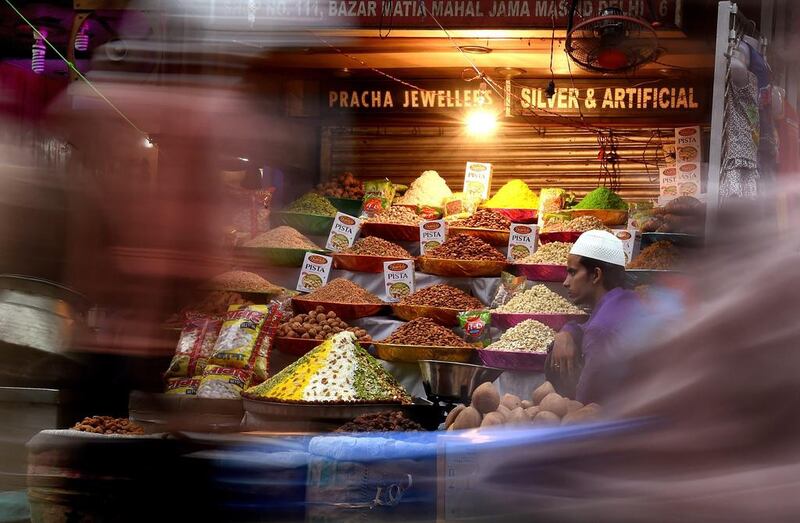 Walking down the alley, you can fill up just by grazing on snacks that shops and restaurants sell. Harish Tyagi/EPA