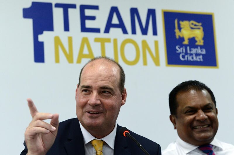 Newly appointed Sri Lanka's cricket team head coach Mickey Arthur (L) speaks as Sri Lanka cricket president Shammi Silva smiles during a press conference in Colombo on December 5, 2019. Sri Lanka's cricket board on December 5 announced a major revamp with the appointment of South African Mickey Arthur as the new "consultant head coach" to rebuild the national team. / AFP / Ishara S. KODIKARA
