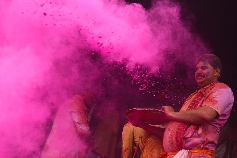 Hindu devotees celebrate Holi, the spring festival of colours, during a traditional gathering at a temple in Nandgaon village in Uttar Pradesh state on March 5, 2020. Holi is observed in India at the end of the winter season on the last full moon of the lunar month. AFP