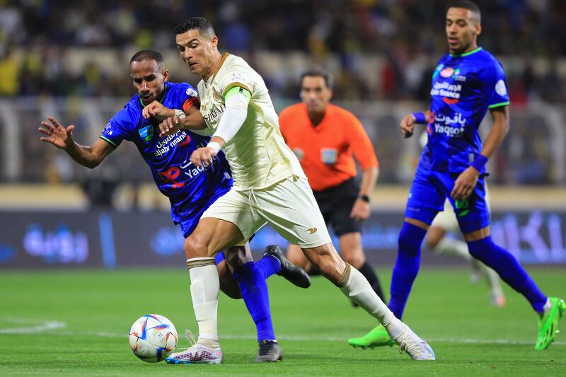 Nassr's Portuguese forward Cristiano Ronaldo fights for the ball with past Fateh's Saudi midfielder Mohammed Al Fuhaid. AFP