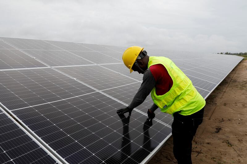 A technician works on solar power panels at the Atlantic Shrimpers farm in Badagry, Lagos, Nigeria. Reuters