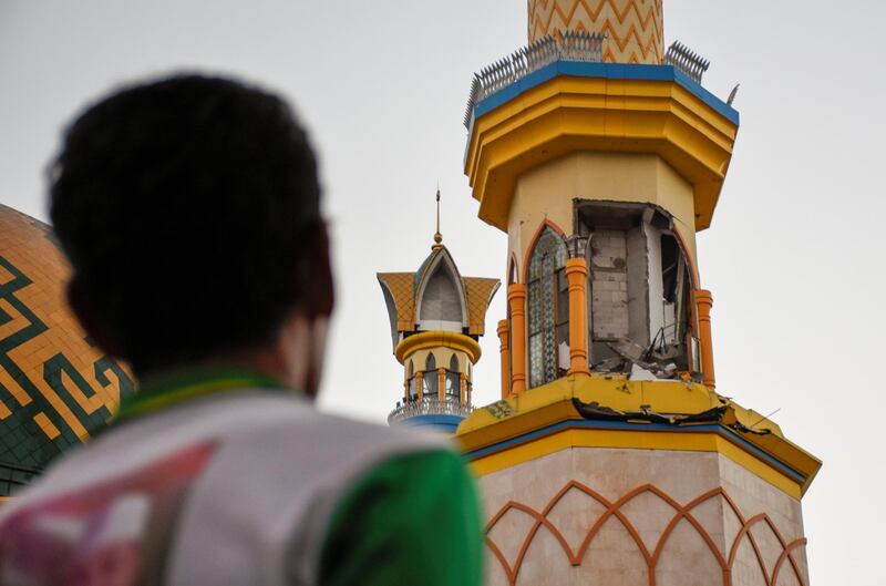 A man looks damage to a mosque following a strong earthquake in Mataram, Lombok island. Reuters