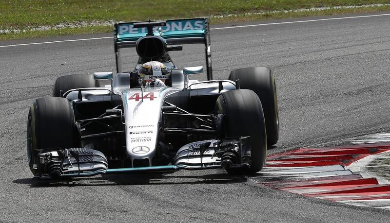 Mercedes driver Lewis Hamilton of Britain steers his car during the Malaysian Formula One Grand Prix. Vincent Thian / AP Photo