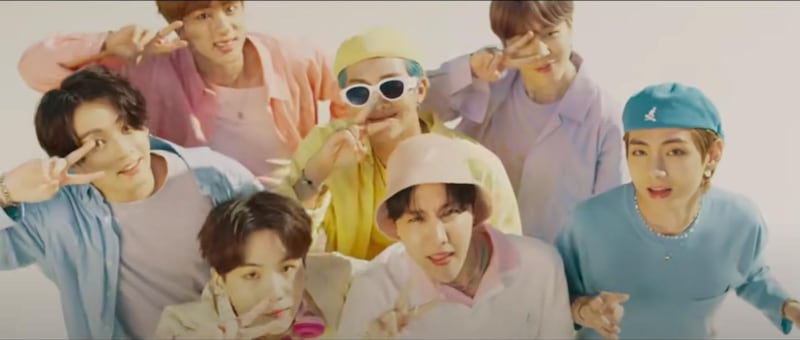 The candy-coloured looks BTS wore in the 'Dynamite' video have been auctioned off. YouTube / Big Hit Labels  