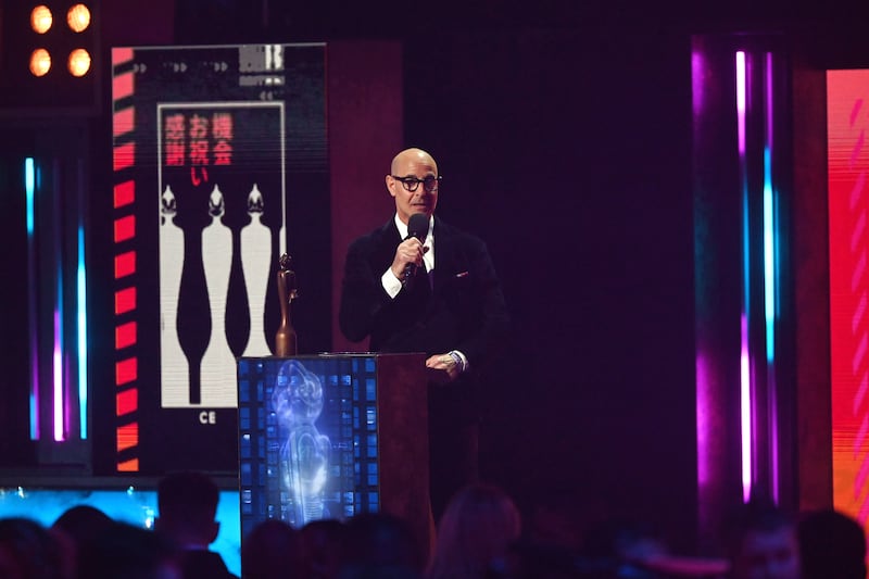Stanley Tucci presents the award for Album of the Year. EPA