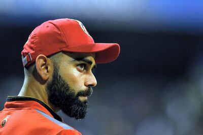 Royal Challengers Bangalore captain Virat Kohli looks on during the 2019 Indian Premier League (IPL) Twenty20 cricket match between Mumbai Indians and Royal Challengers Bangalore at the Wankhede Stadium in Mumbai on April 15, 2019. (Photo by Indranil MUKHERJEE / AFP) / ----IMAGE RESTRICTED TO EDITORIAL USE - STRICTLY NO COMMERCIAL USE----- / GETTYOUT