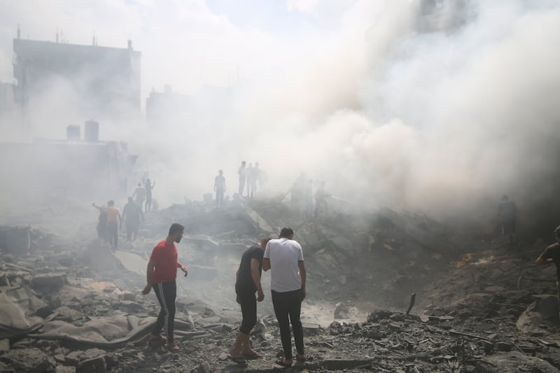 Palestinians look for survivors after an Israeli air strike in Rafah refugee camp in the southern Gaza Strip. AP