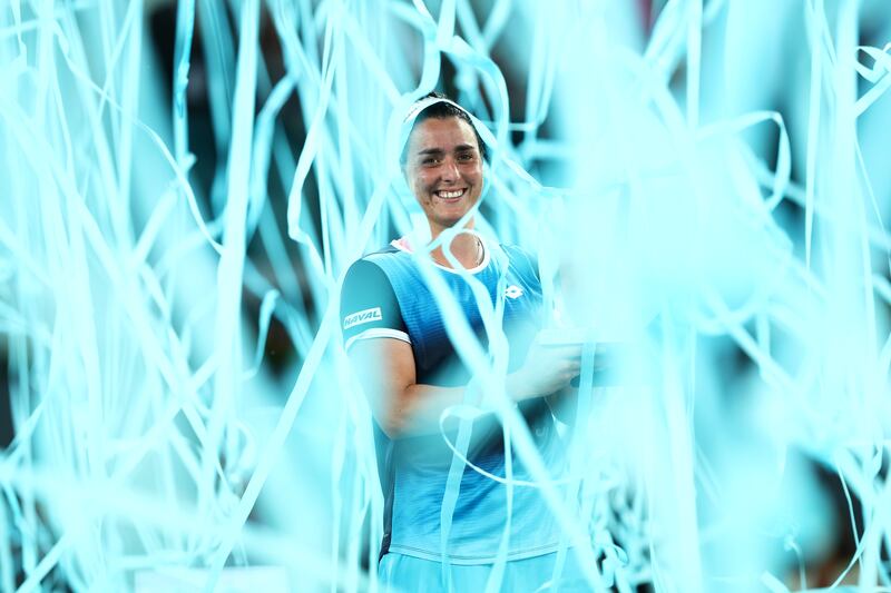 Ons Jabeur celebrates with the Madrid Open trophy following victory in the final against Jessica Pegula at La Caja Magica on May 07, 2022 in Madrid, Spain. Getty