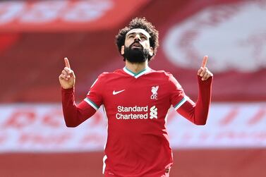 (FILES) In this file photo taken on April 10, 2021 Liverpool's Egyptian midfielder Mohamed Salah celebrates after scoring his team's first goal during the English Premier League football match between Liverpool and Aston Villa at Anfield in Liverpool, north west England.  - Mohamed Salah ended speculation over his future by signing a new contract with Liverpool on Friday, July 1, that will reportedly run to 2025.  The Egyptian, who has scored 156 goals in 254 appearances for the Reds, had entered the final year of his previous contract.  (Photo by Laurence Griffiths / POOL / AFP) / RESTRICTED TO EDITORIAL USE.  No use with unauthorized audio, video, data, fixture lists, club/league logos or 'live' services.  Online in-match use limited to 120 images.  An additional 40 images may be used in extra time.  No video emulation.  Social media in-match use limited to 120 images.  An additional 40 images may be used in extra time.  No use in betting publications, games or single club/league/player publications.   /  