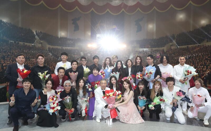 South and North Korean musicians pose for a group photo after a joint show. AFP / Korea Pool