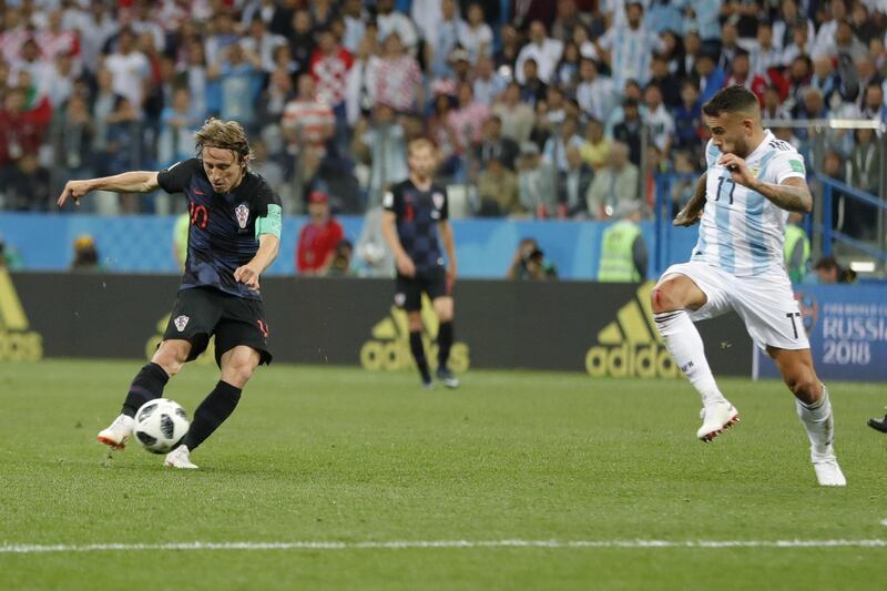 Croatia's Luka Modric shoots the ball to score his side's second goal during the group D match between Argentina and Croatia at the 2018 soccer World Cup in Nizhny Novgorod Stadium in Nizhny Novgorod, Russia, Thursday, June 21, 2018. Modric scored once in Croatia's 3-0 victory. (AP Photo/Ricardo Mazalan)