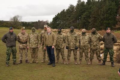 Defence Secretary Grant Shapps with Ukrainian and British soldiers, at Catterick Garrison, in North Yorkshire. PA