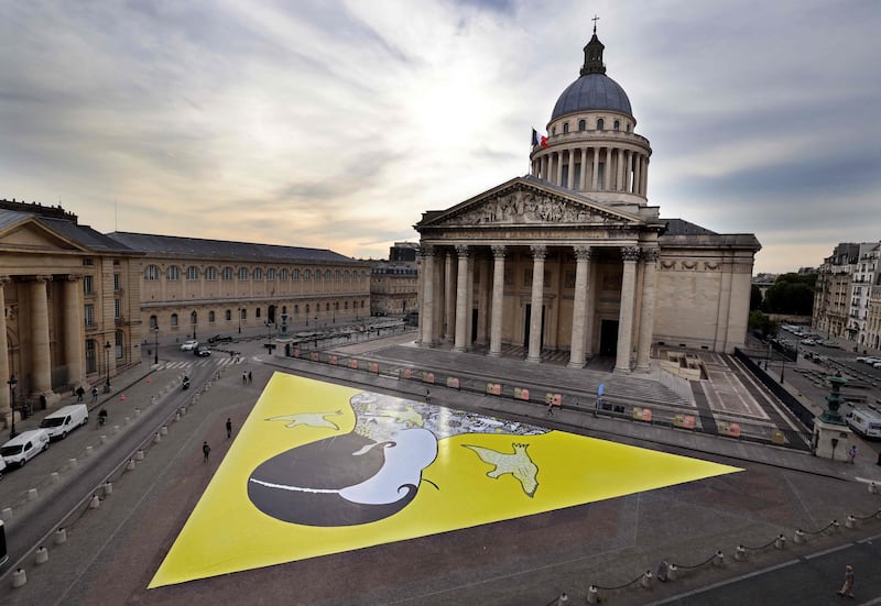 A 1,000-square-metre fresco depicting a giant portrait of Josephine Baker designed by French artist Gwendoline Finaz de Villaine, in front of the Pantheon in Paris. The artwork is like a giant puzzle on the esplanade, some pieces of which will be offered to the public to celebrate the event.  French-American dancer, singer, Resistance member and rights activist Baker was the first black woman to enter France's Pantheon mausoleum of outstanding historical figures on November 30, 2021, nearly half a century after her death. AFP