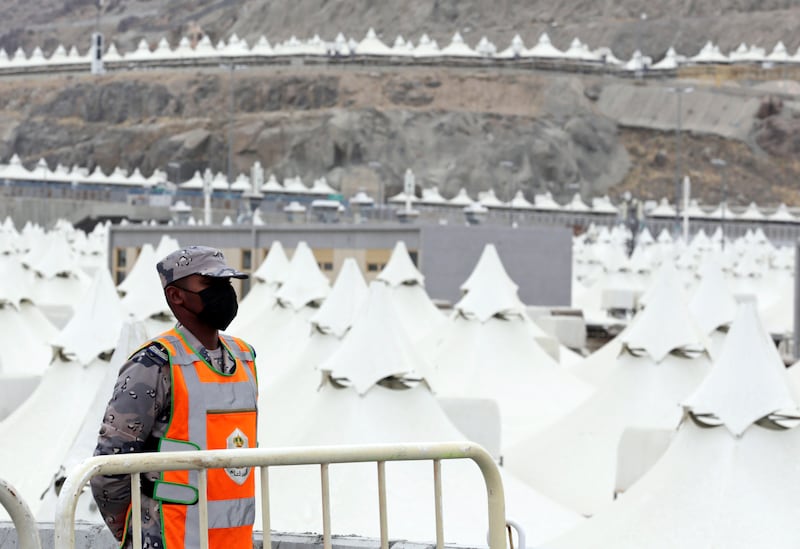 A Saudi soldier stands guard outside the tent city in Mina last year. AP
