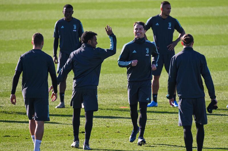 Cristiano Ronaldo, centre right, leaves a Juventus teammate hanging for a High-Five. AFP