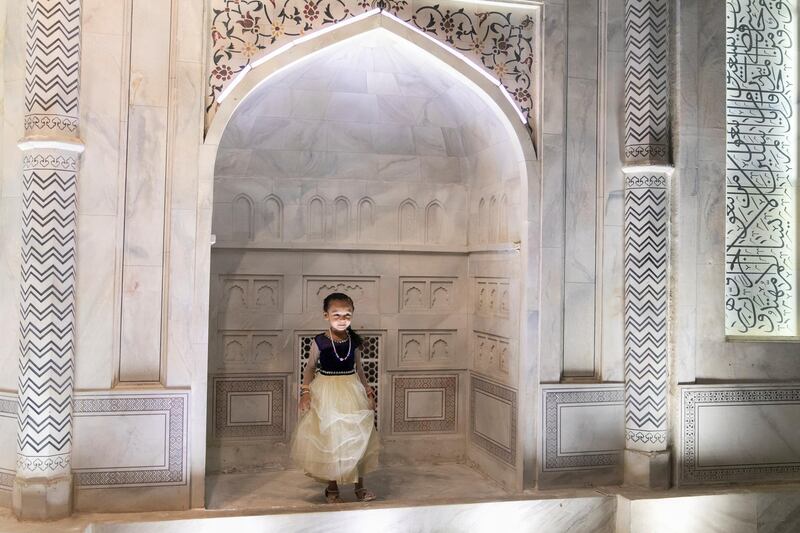 DUBAI, UNITED ARAB EMIRATES - OCTOBER 30, 2018. 

A girl plays by the Taj Mahal structure.

Global Village opened it's gates today to the public for its 23rd season.

(Photo by Reem Mohammed/The National)

Reporter: PATRICK RYAN
Section:  NA