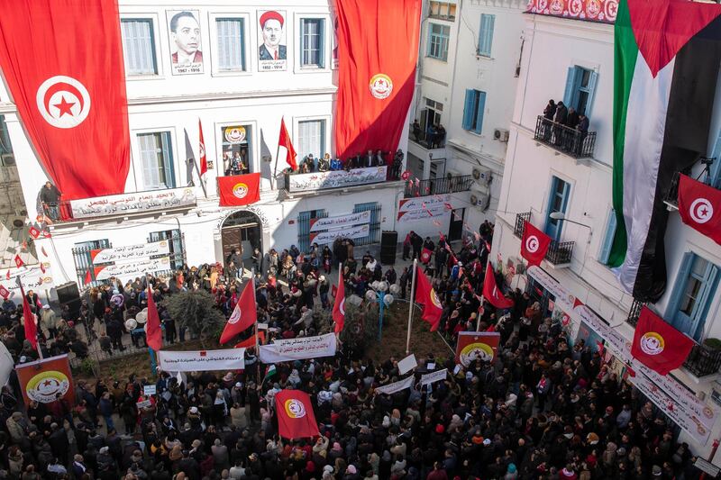 Tunisians protest against their purchasing power during a demonstration to mark the ninth anniversary of the democratic uprising in Tunis, Tuesday, Jan.14, 2020. Tunisia is marking nine years since its democratic uprising amid deepening economic troubles and simmering anger at the revolution's unfulfilled promises. (AP Photo/Hassene Dridi)