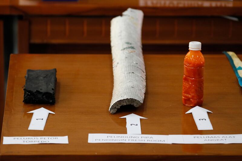 Debris believed to be from a missing Indonesian Navy submarine KRI Nanggala are displayed during a press conference at a command in Ngurah Rai Airport in Bali. EPA