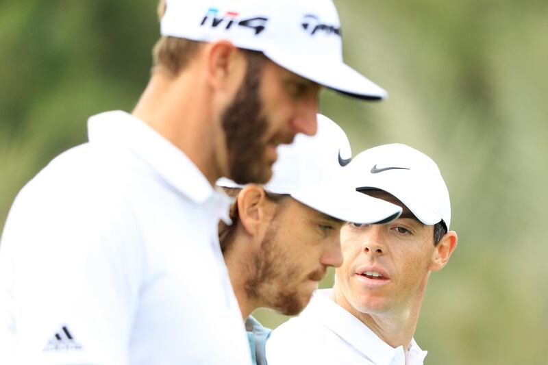 ABU DHABI, UNITED ARAB EMIRATES - JANUARY 18:  Dustin Johnson of the United States, Tommy Fleetwood of England and Rory McIlroy of Northern Ireland walk on the eighth hole during round one of the Abu Dhabi HSBC Golf Championship at Abu Dhabi Golf Club on January 18, 2018 in Abu Dhabi, United Arab Emirates.  (Photo by Andrew Redington/Getty Images)