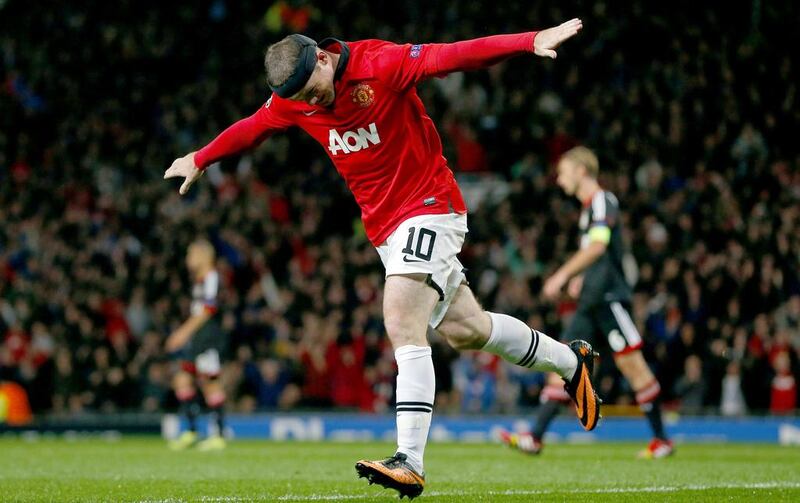 Manchester United striker Wayne Rooney celebrates scoring during a UEFA Champions League match. The football team's official website counts at least 26 commercial partners. Andrew Yates / AFP