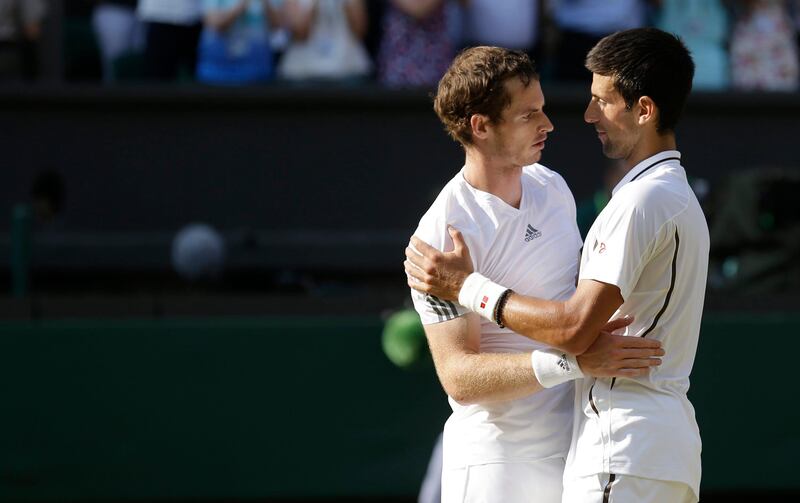 Andy Murray of Britain, left, is congratulated by Novak Djokovic of Serbia after he won the Men's singles final match at the All England Lawn Tennis Championships in Wimbledon, London, Sunday, July 7, 2013. (AP Photo/Anja Niedringhaus, Pool) *** Local Caption ***  Britain Wimbledon Tennis.JPEG-04851.jpg