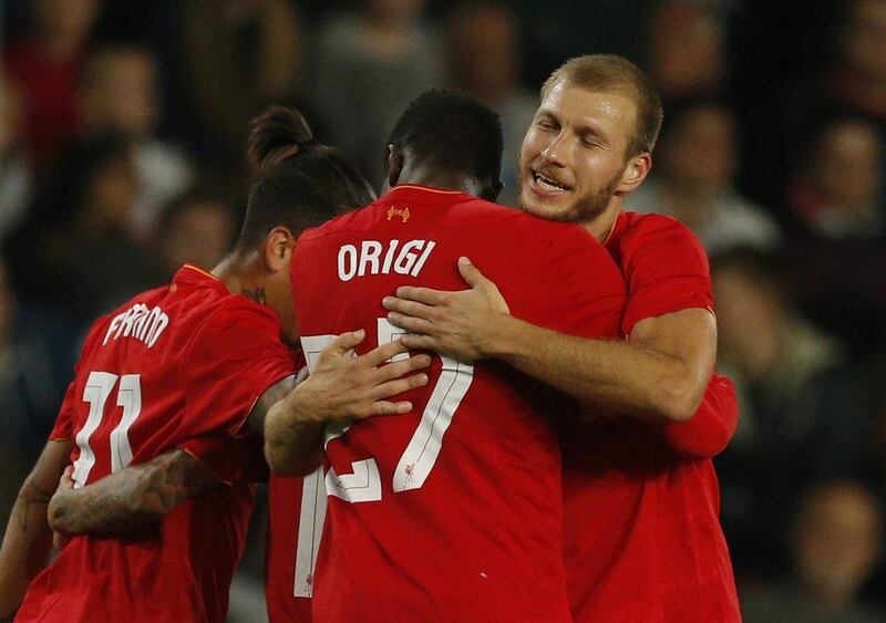 Liverpool’s Divock Origi celebrates scoring their third goal with Ragnar Klavan. Andrew Boyers / Action Images / Reuters
