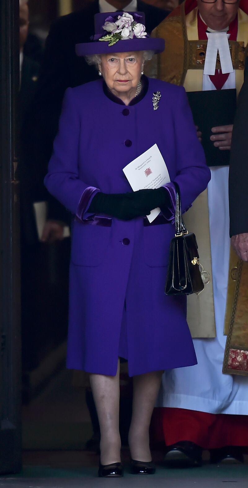 Queen Elizabeth II, in purple, leaves a Service of Thanksgiving at Westminster Abbey on April 7, 2017, in London. Getty Images