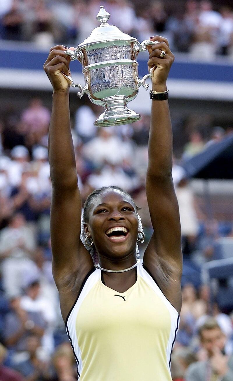 Serena Williams of the US holds the US Open trophy after defeating number one seed  Martina Hingis of Switzerland 11 September,1999, at the US Open Womens Final in Flushing Meadows, NY. Williams won the match 6-3, 7-6 (7/4).   (ELECTRONIC IMAGE)  AFP PHOTO/TIMOTHY A. CLARY (Photo by Timothy A. CLARY / AFP)