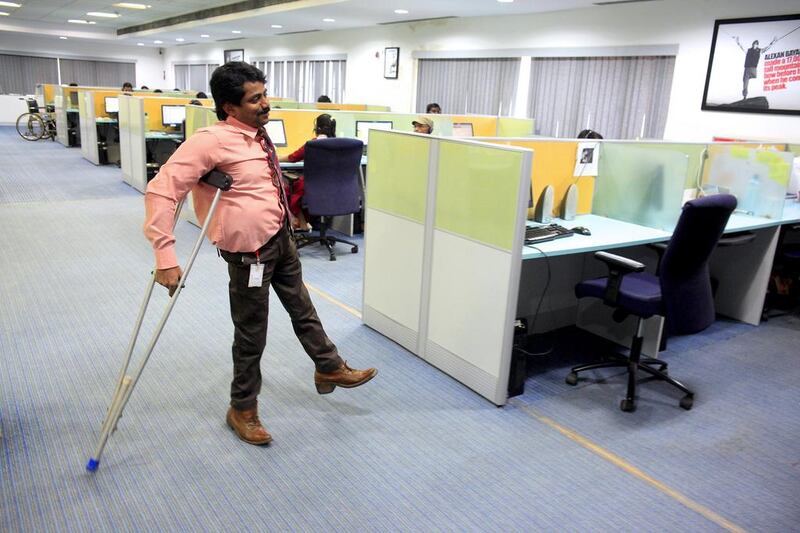 Rajeev Mehta is one of about 90 physically challenged Indians who work at the EuroAble call centre in Chembur, Mumbai. Subhash Sharma for The National