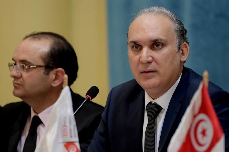 Tunisian President of the Independent High Authority for Elections (ISIE) Nabil Baffoun (R) gives a press conference to release the dates of the legislative and presidential 2019 elections on March 6, 2019 in Tunis. / AFP / FETHI BELAID
