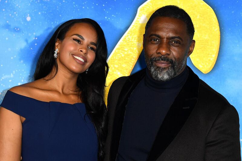 (FILES) In this file photo taken on December 17, 2019 Enlgish actor Idris Elba (R) and wife Sabrina Dhowre Elba arrive for the world premiere of "Cats" at the Alice Tully Hall in New York City, on December 16, 2019.  British actor Idris Elba and his wife Sabrina have supported the UN Fund Fida, which is launching a new financial tool to help rural people in poor countries cope with the economic consequences of the Covid-19 pandemic, Fida reports. / AFP / ANGELA WEISS
