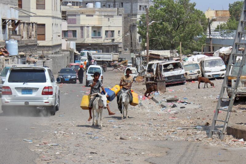 Yemeni youths ride donkeys along a street in the southern port city of Aden. AFP