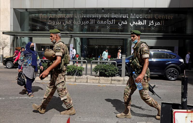 Lebanese army soldiers walk as they secure the area outside American University of Beirut (AUB) medical centre. Reuters