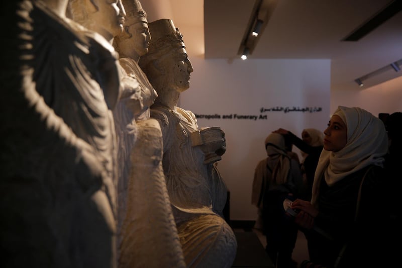 Visitors look at sculptures displayed during the reopening of Syria's National Museum of Damascus, Syria October 28, 2018. REUTERS/Omar Sanadiki