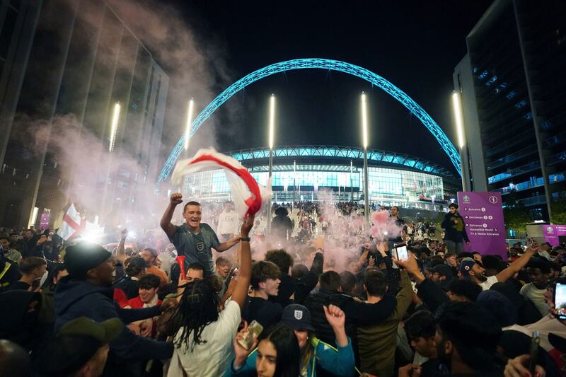England fans celebrate outside Wembley Stadium.