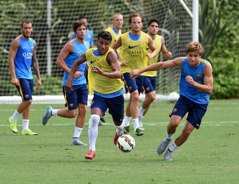 Barcelona players vie for the ball on Monday during a training session in Los Angeles as part of the club's US tour. Mark Ralston / AFP