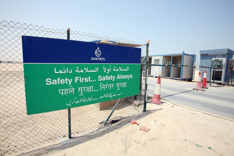 DUBAI, UNITED ARAB EMIRATES - AUGUST 29:  A Nakheel safety board outside the Palm Jebel Ali project site in Dubai on August 29, 2009.  (Randi Sokoloff / The National)  For Stock *** Local Caption ***  RS002-082909-NAKHEEL.jpg