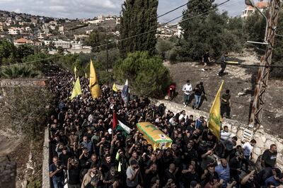 Hezbollah supporters carry the coffin of a Hezbollah fighter killed yesterday during clashes with Israeli forces in southern Lebanon on October 18, 2023 in Kounine, Lebanon. Getty Images