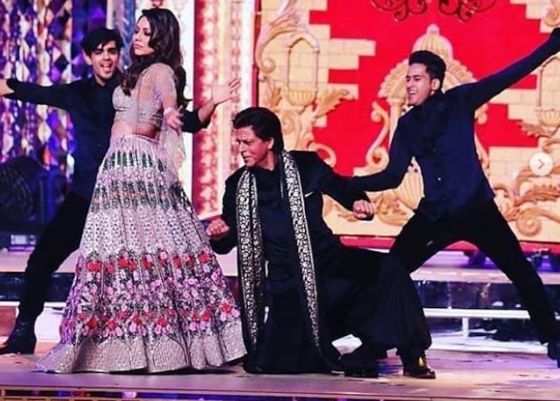 Shah Rukh Khan and his wife Gauri Khan perform at Isha Ambani's sangeet, a pre-wedding celebration. Handout