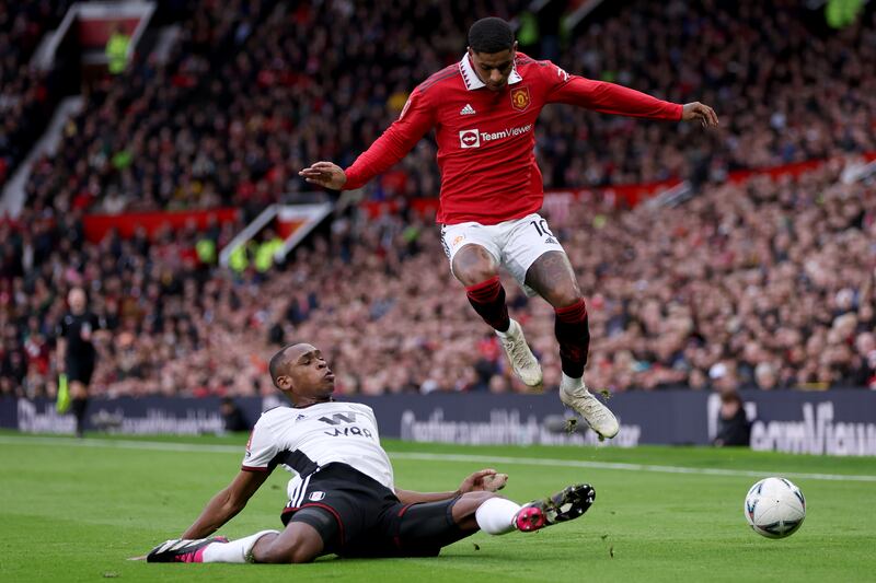 United's Marcus Rashford is challenged by Issa Diop of Fulham. Getty