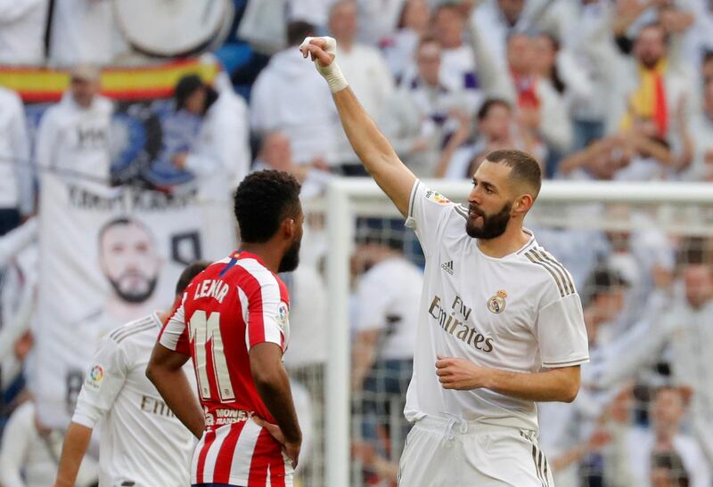 Real Madrid's Karim Benzema celebrates scoring his team's first goal against Atletico Madrid at the Santiago Bernabeu. Reuters