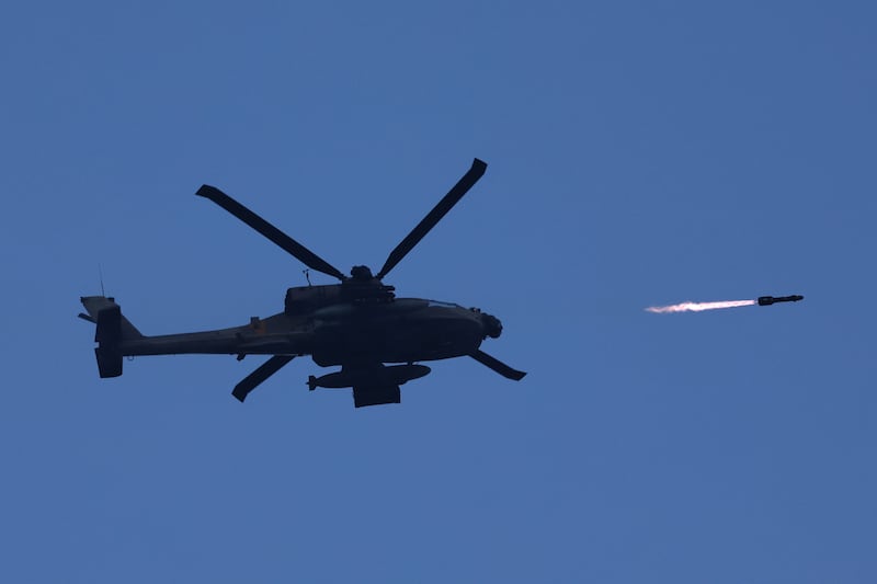 An Israeli military helicopter fires a missile. EPA