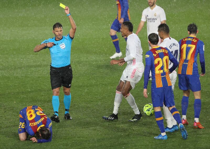 Spanish referee Jesus Gil Manzano shows the second yellow card to Real Madrid's Casemiro. EPA