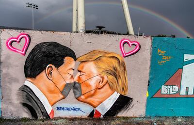 epa08414092 (FILE) - A mural by the street artist EME Freethinker of US President Donald Trump and President of the People's Republic of China Xi Jinping kissing as they wear surgical masks at Mauer park  in Berlin, Germany, 29 April 2020 (reissued 11 May 2020). Some of EME's murals comment on the worldwide COVID-19 pandemic. Press pictures of his paintings like the 'Lord of the Rings' character 'Gollum' saying 'my precious' while holding a roll of toilet paper, or US President Donald Trump and Chinese President Xi Jinping kissing while wearing surgical face masks, were published in many countries. EME Freethinker moved to Germany three years ago and has been living and working in Berlin for two years.  EPA/ALEXANDER BECHER *** Local Caption *** 55971219