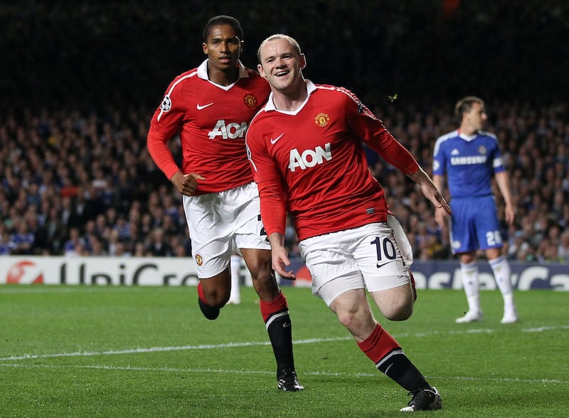 Manchester United's English striker Wayne Rooney (Foreground) celebrates scoring a goal against Chelsea during their UEFA Champions League Quarter Final, 1st leg football match at Stamford Bridge, in London, on April 6, 2011. AFP PHOTO/ADRIAN DENNIS / AFP PHOTO / ADRIAN DENNIS