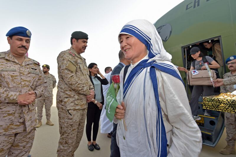 Having fled from Sudan, a South Korean nun disembarks from a military plane after landing at King Abdullah Air Base in Jeddah. AFP
