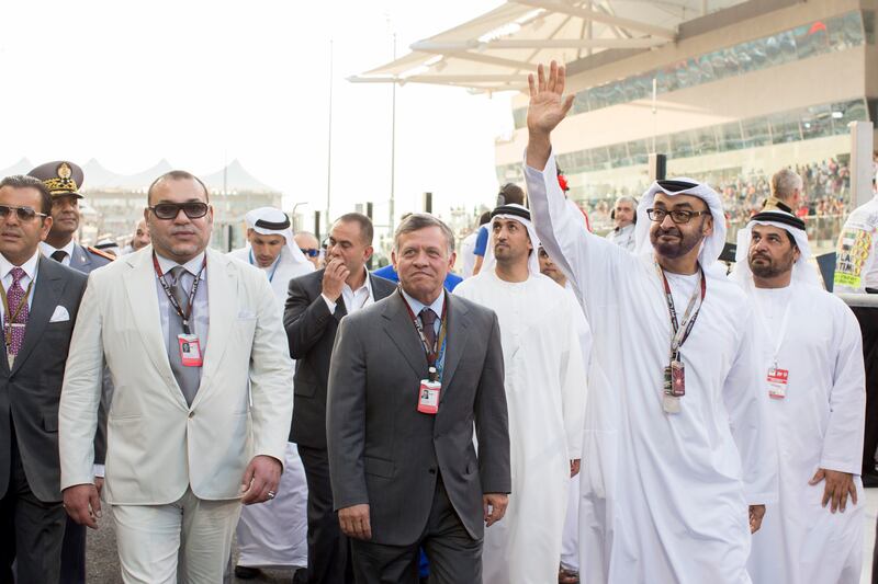 ABU DHABI, UNITED ARAB EMIRATES - November 03, 2013: HH General Sheikh Mohamed bin Zayed Al Nahyan Crown Prince of Abu Dhabi Deputy Supreme Commander of the UAE Armed Forces (R), HM King Abdullah II King of Jordan (C), and HM King Mohammed VI of Morocco (L), walk the pit lane prior to the final race of the Formula 1 Etihad Airways Abu Dhabi Grand Prix at Yas Marina Circuit.
( Ryan Carter / Crown Prince Court - Abu Dhabi )
--- *** Local Caption ***  20131103RC_C6_6050.JPG