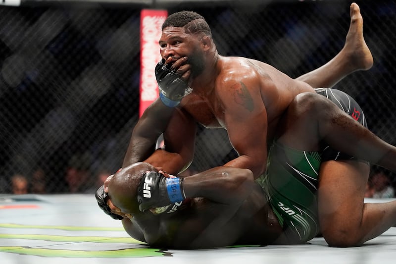 Curtis Blaydes, top, wrestles Jairzinho Rozenstruik. Blaydes won the fight on the judges scorecards. AP Photo