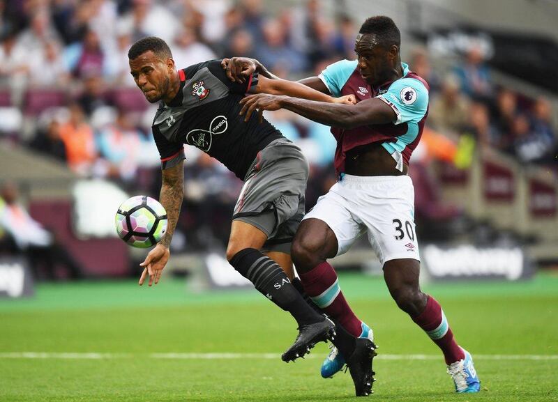 Ryan Bertrand of Southampton and Michail Antonio of West Ham United battle for the ball. Shaun Botterill / Getty Images
