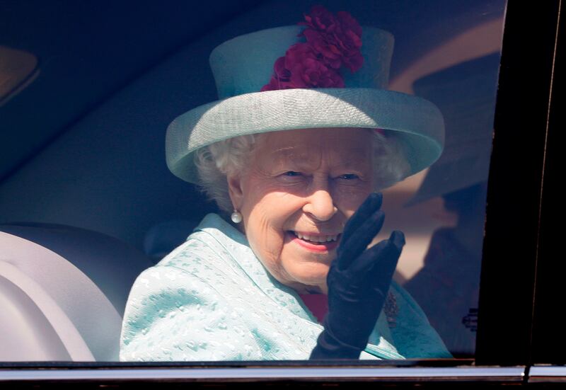 (FILES) In this file photo taken on April 21, 2019, Britain's Queen Elizabeth II waves from her car after attending the Easter Mattins Service at St. George's Chapel, Windsor Castle. Queen Elizabeth II will retire to Windsor Castle a week early and a state visit by the emperor and empress of Japan is being reviewed due to coronavirus, Buckingham Palace said Tuesday, March 17. The 93-year-old monarch has already postponed some public engagements, and further changes are now being made to her diary in the wake of stricter measures introduced by the British government.
 / AFP / POOL / KIRSTY WIGGLESWORTH
